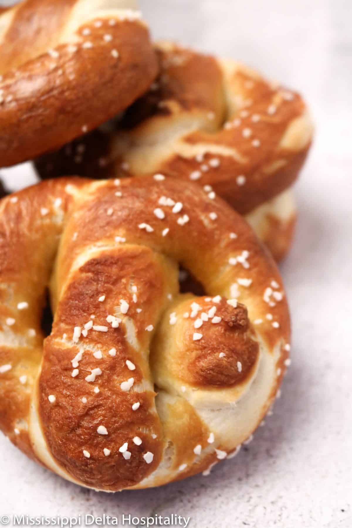 pretzels stacked on a concrete board.