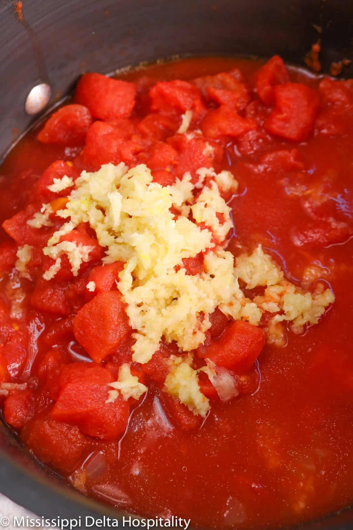 tomatoes and garlic in a pot