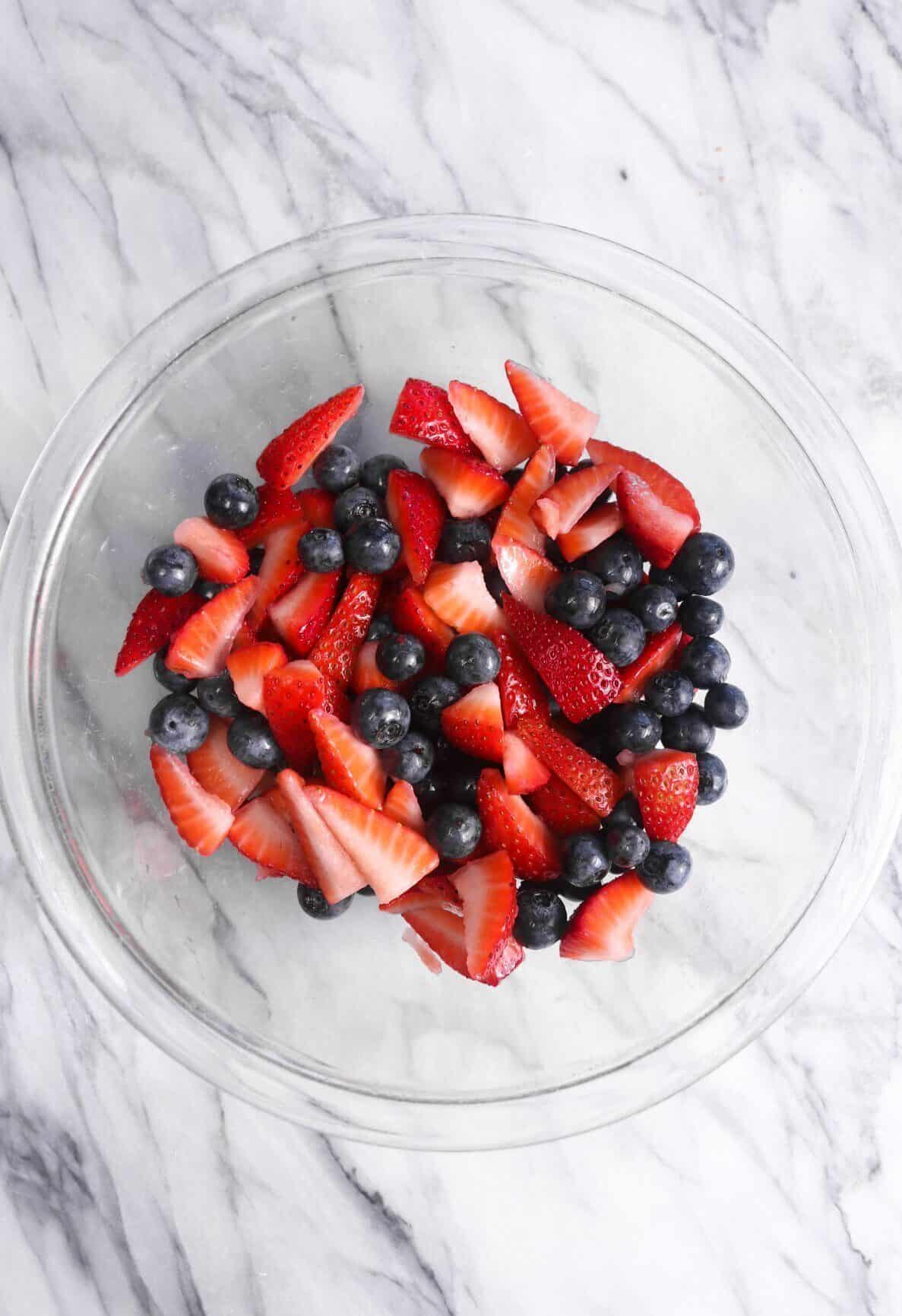chopped berries in a glass bowl
