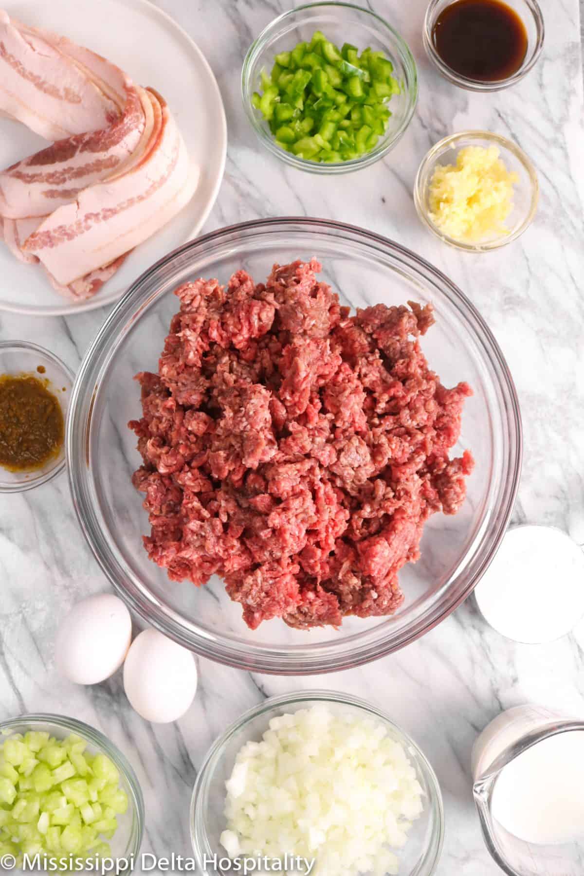 ingredients for meatloaf on a marble board