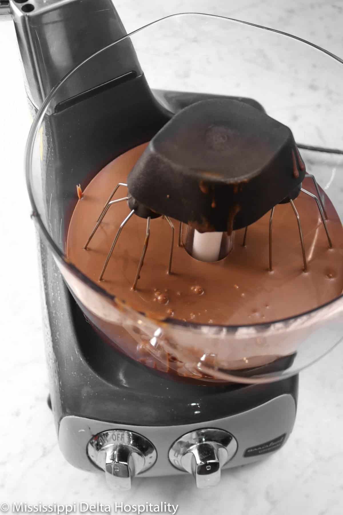 ganache in a mixer on a marble board
