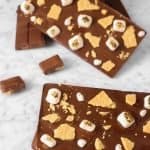 four homemade chocolate bars with marshmallows and graham crackers