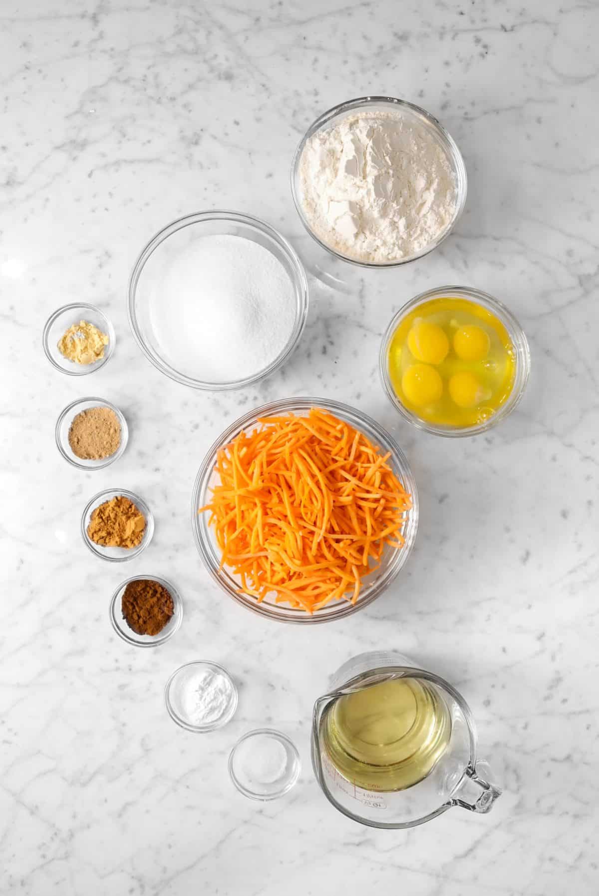 ingredients for carrot cake cupcakes on a marble table
