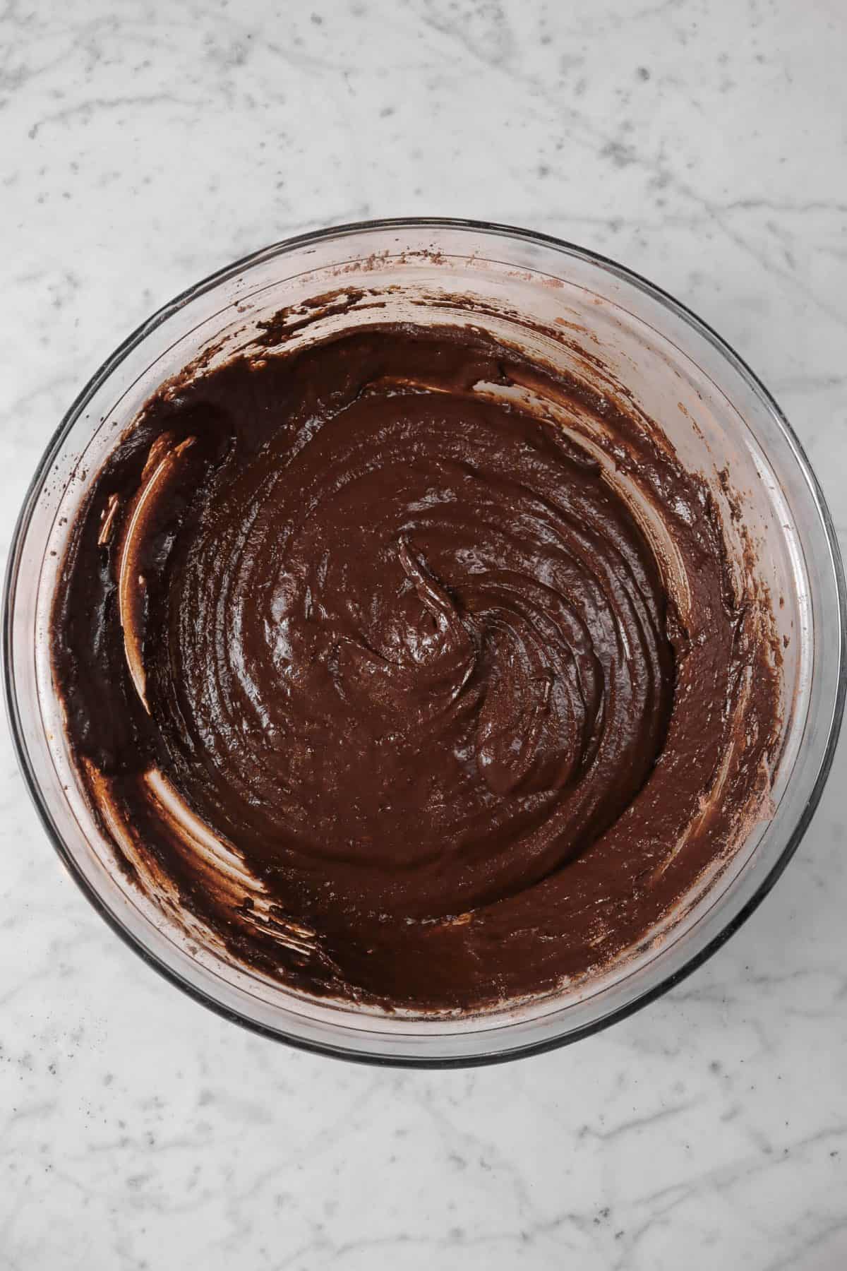 vegan chocolate muffins batter in a glass bowl