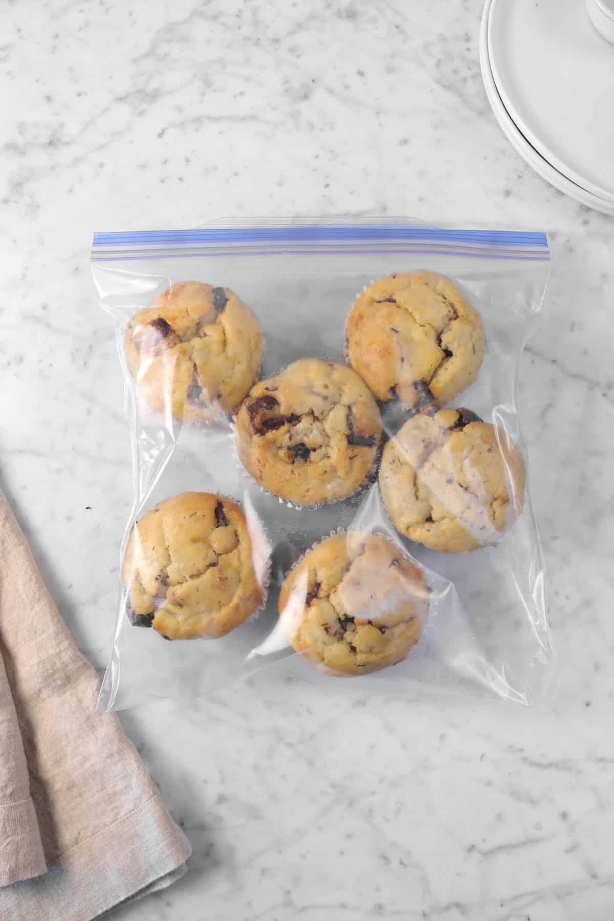 muffins in a ziploc bag on a marble table