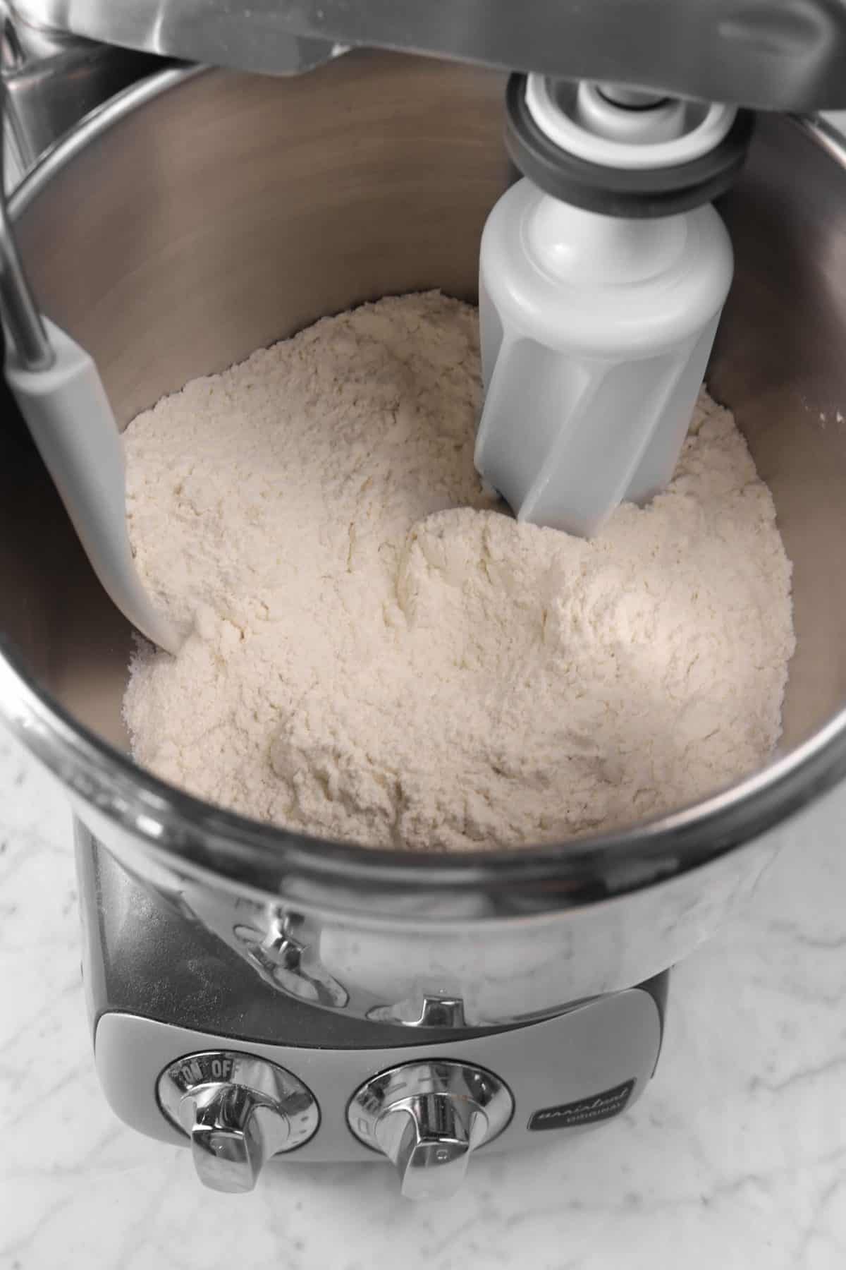 dry ingredients for cinnamon rolls in a mixer