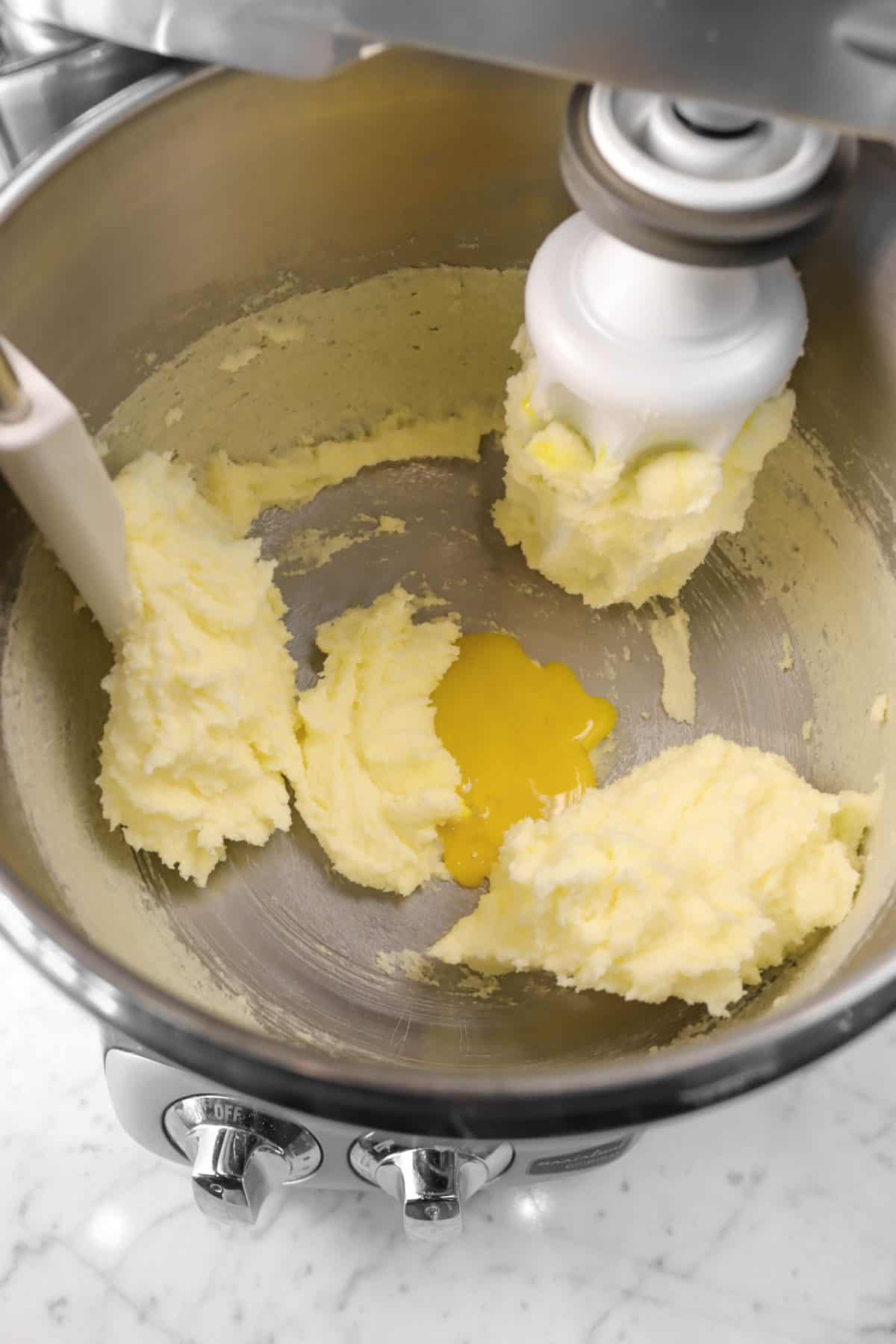 egg yolk added to butter and sugar mixture