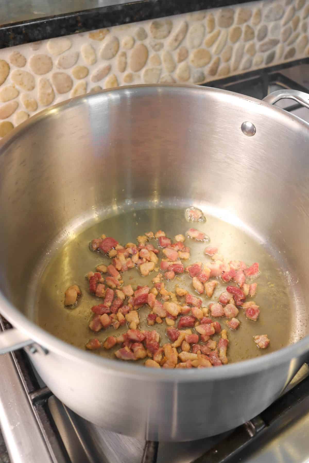 Sautéed prosciutto in a stock pot