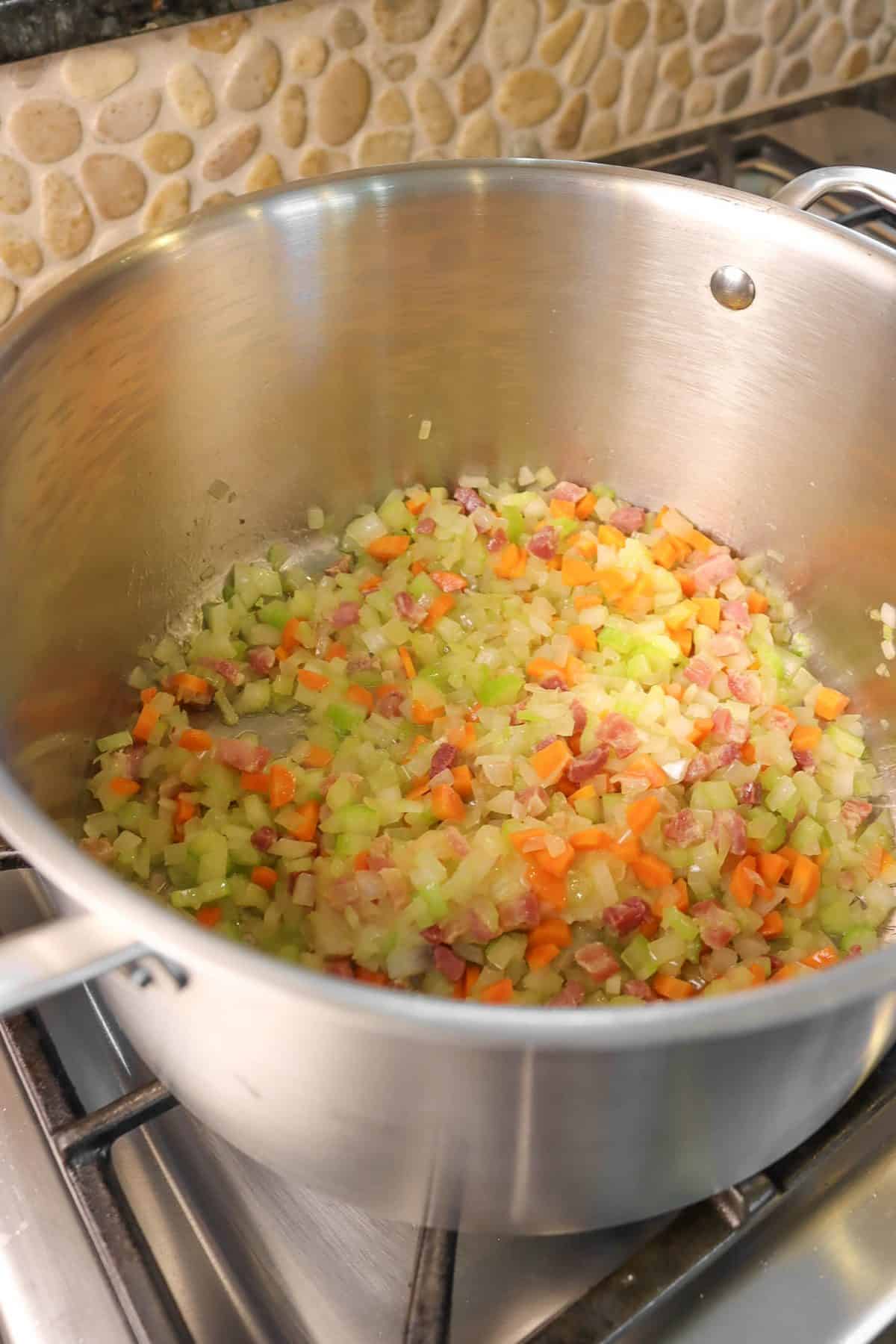 Sautéed vegetables in a stock pot