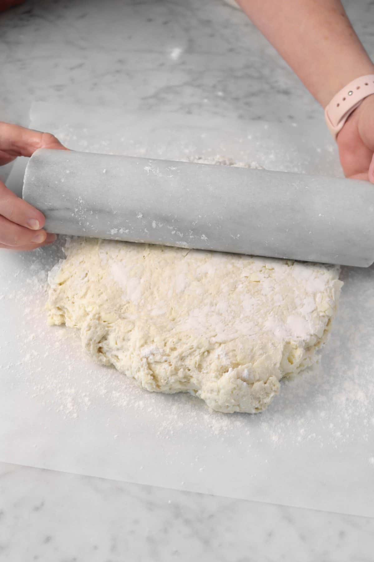 sourdough biscuit dough being rolled out
