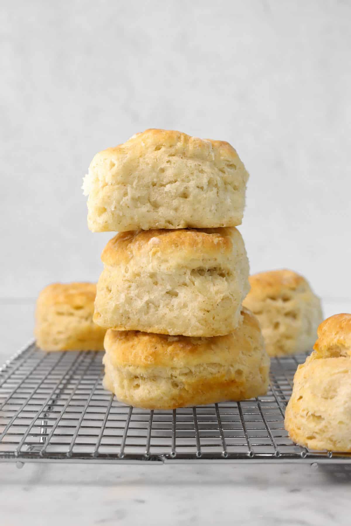 three biscuits stacked on top of each other on a wire cooling rack