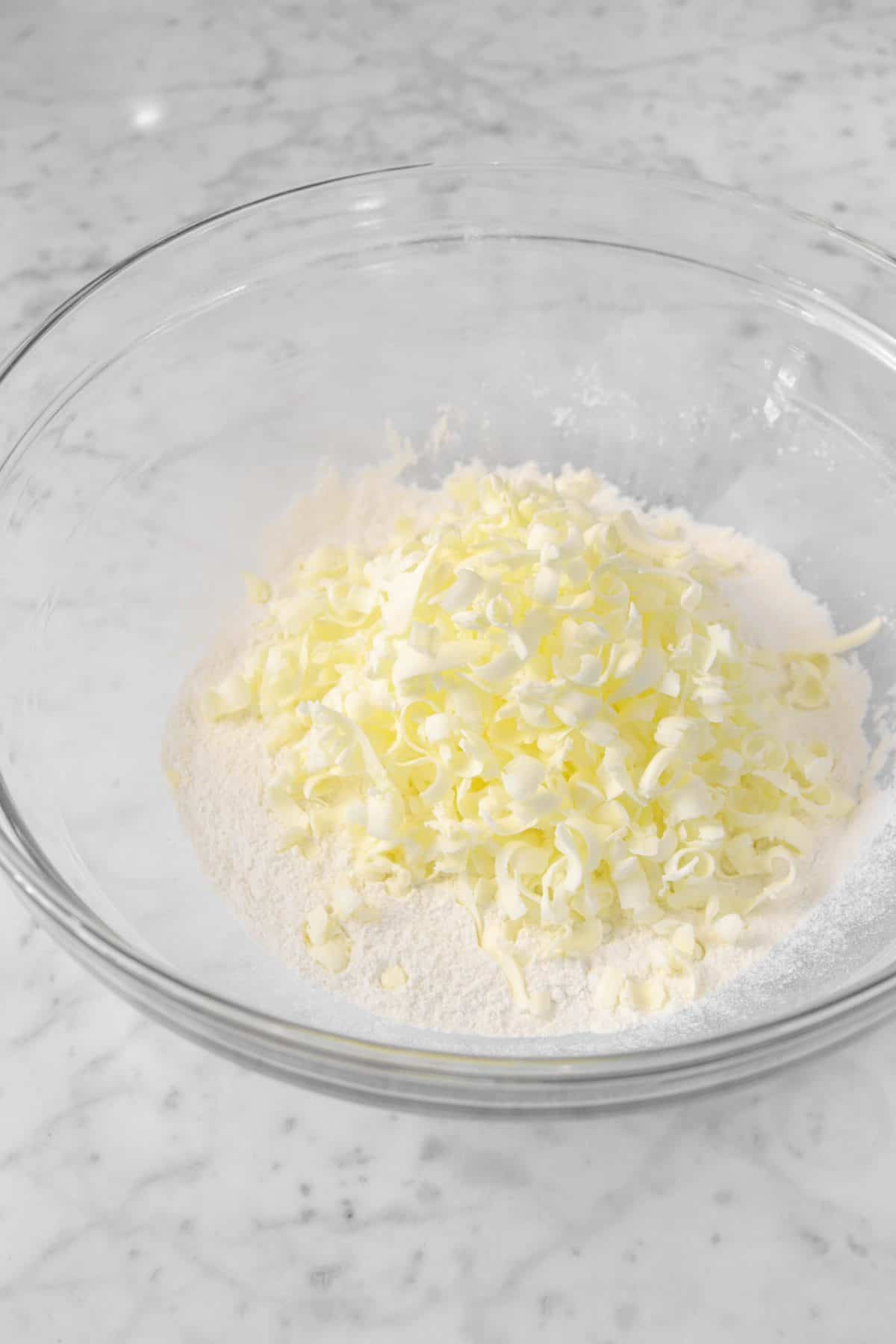 butter grated into a glass bowl