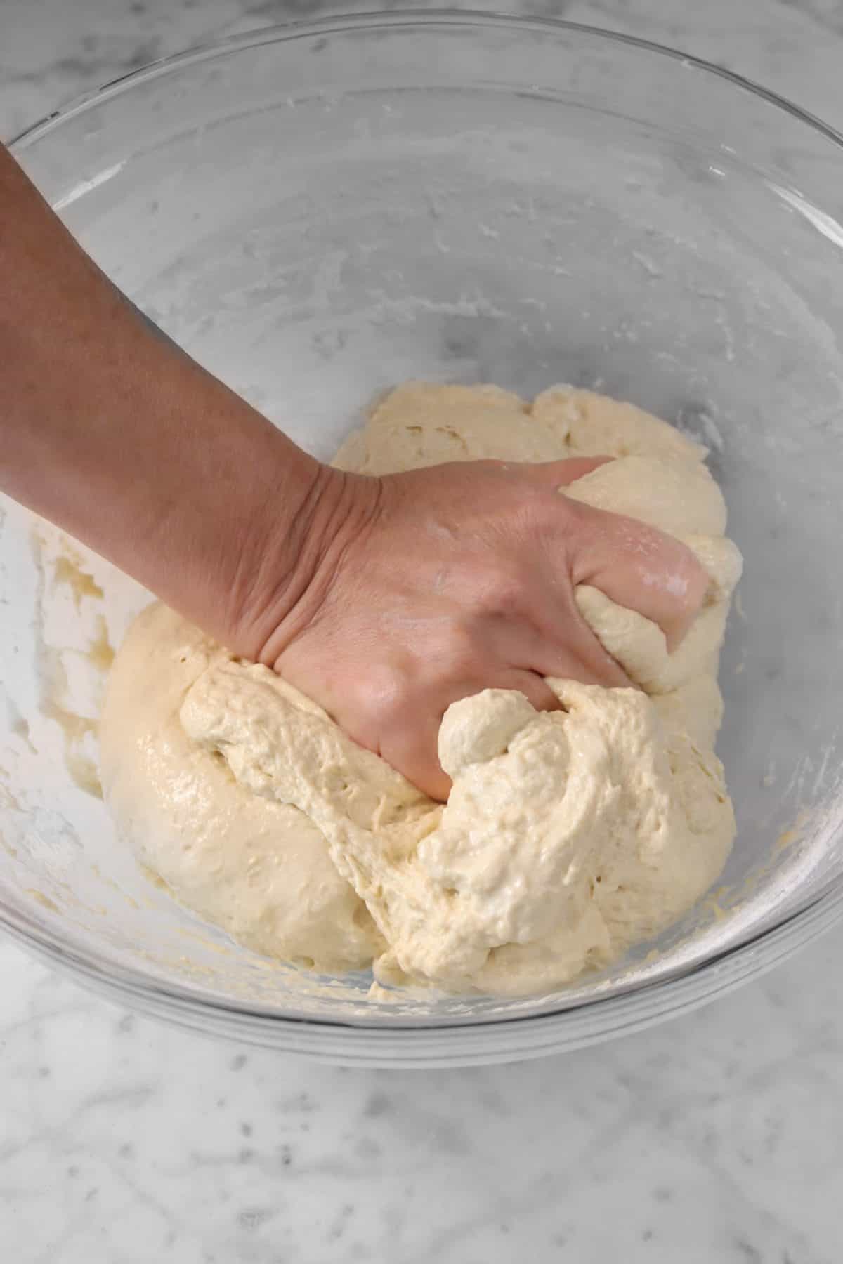 salt being worked into dough