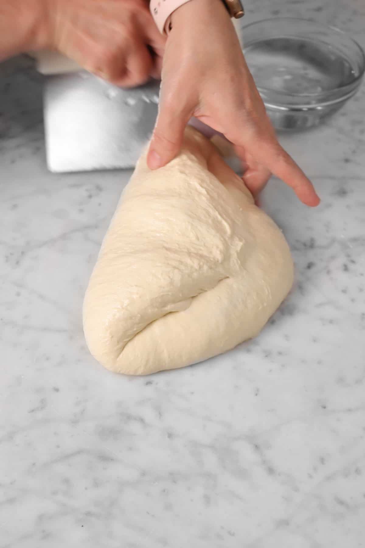 dough being folded over in haf