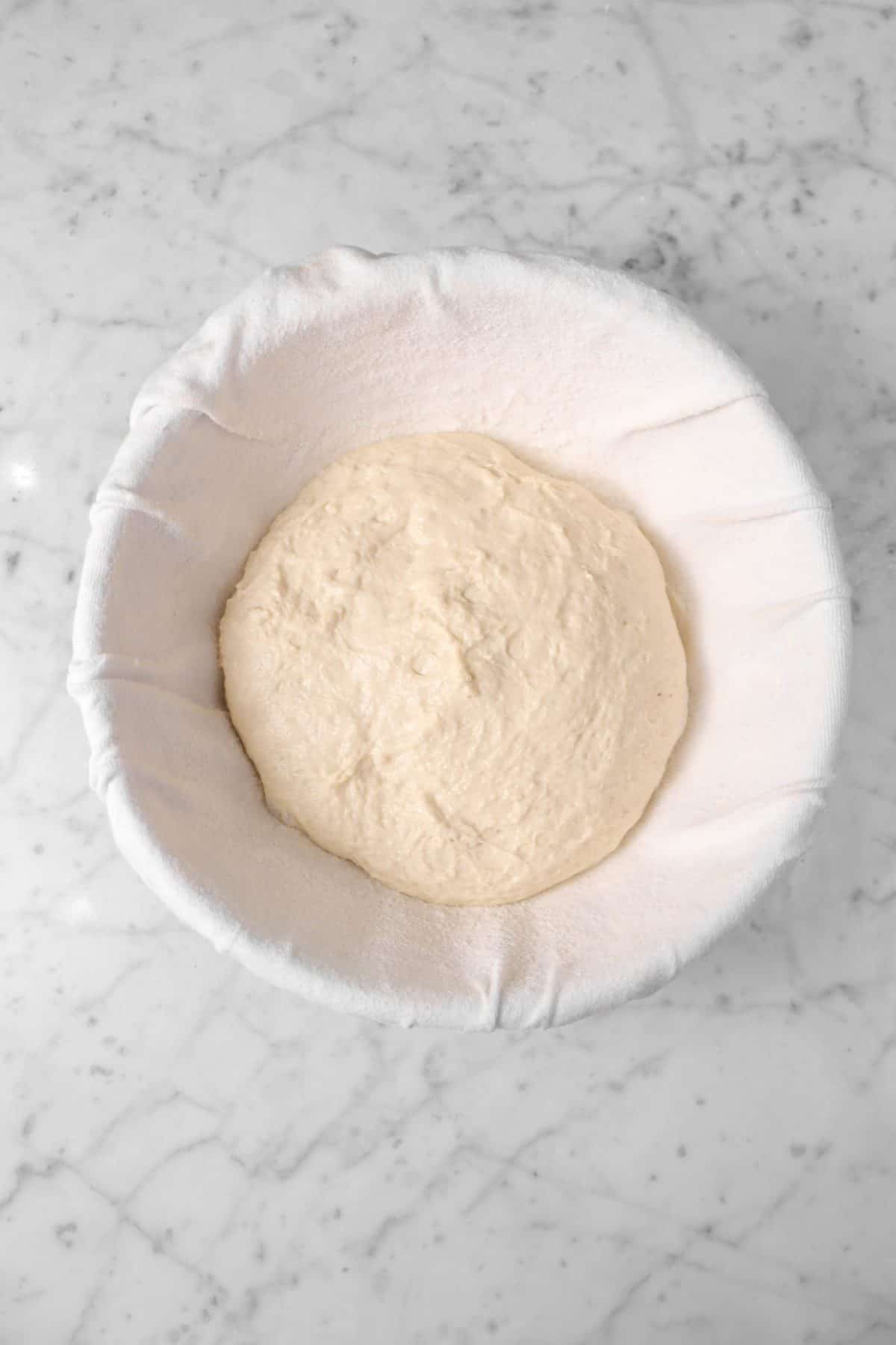 dough placed in a floured banneton