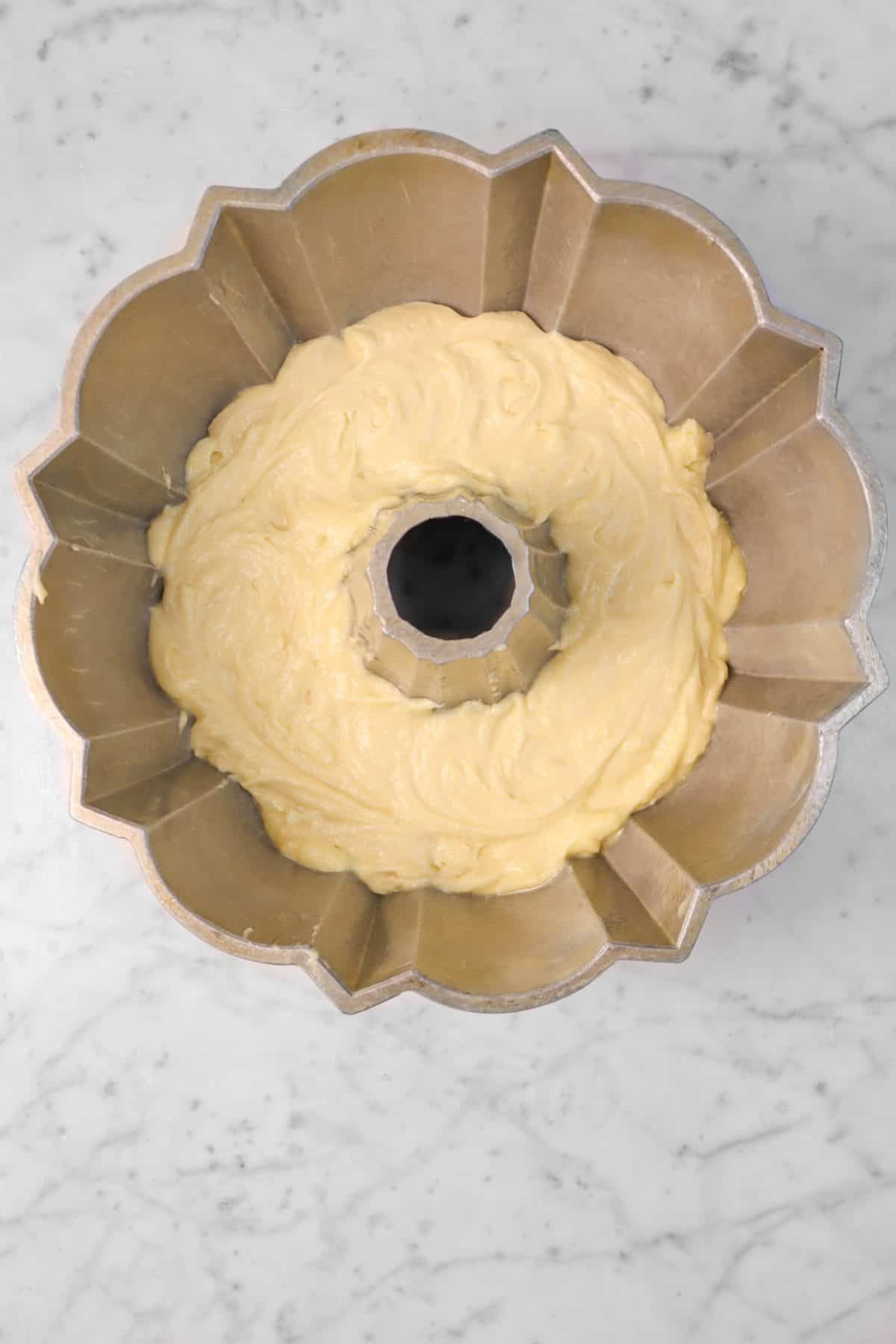 vanilla cake batter in a bundt pan