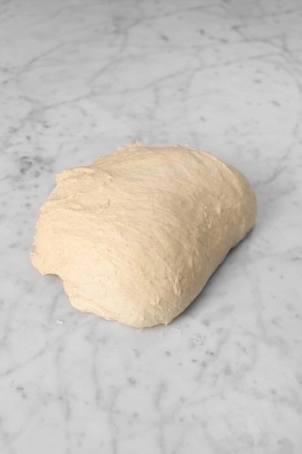 dough folded over in half upwards.