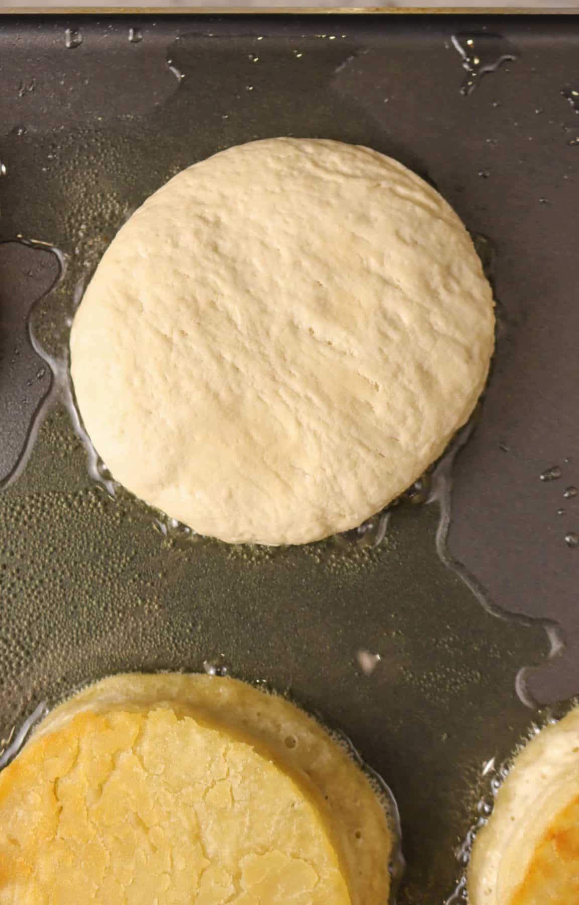 english muffin dough on a griddle