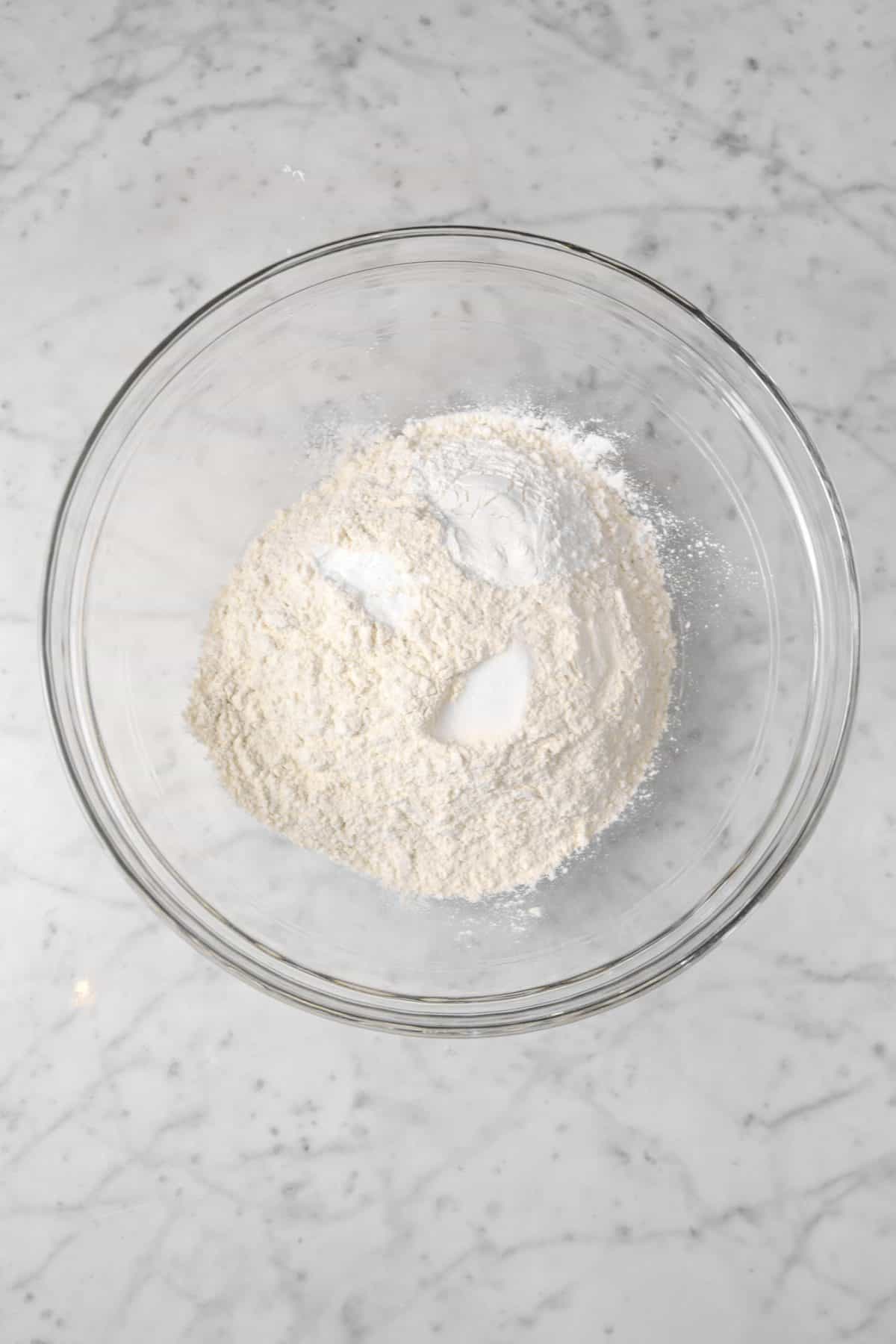 flour, salt, baking powder, and baking soda in a glass bowl