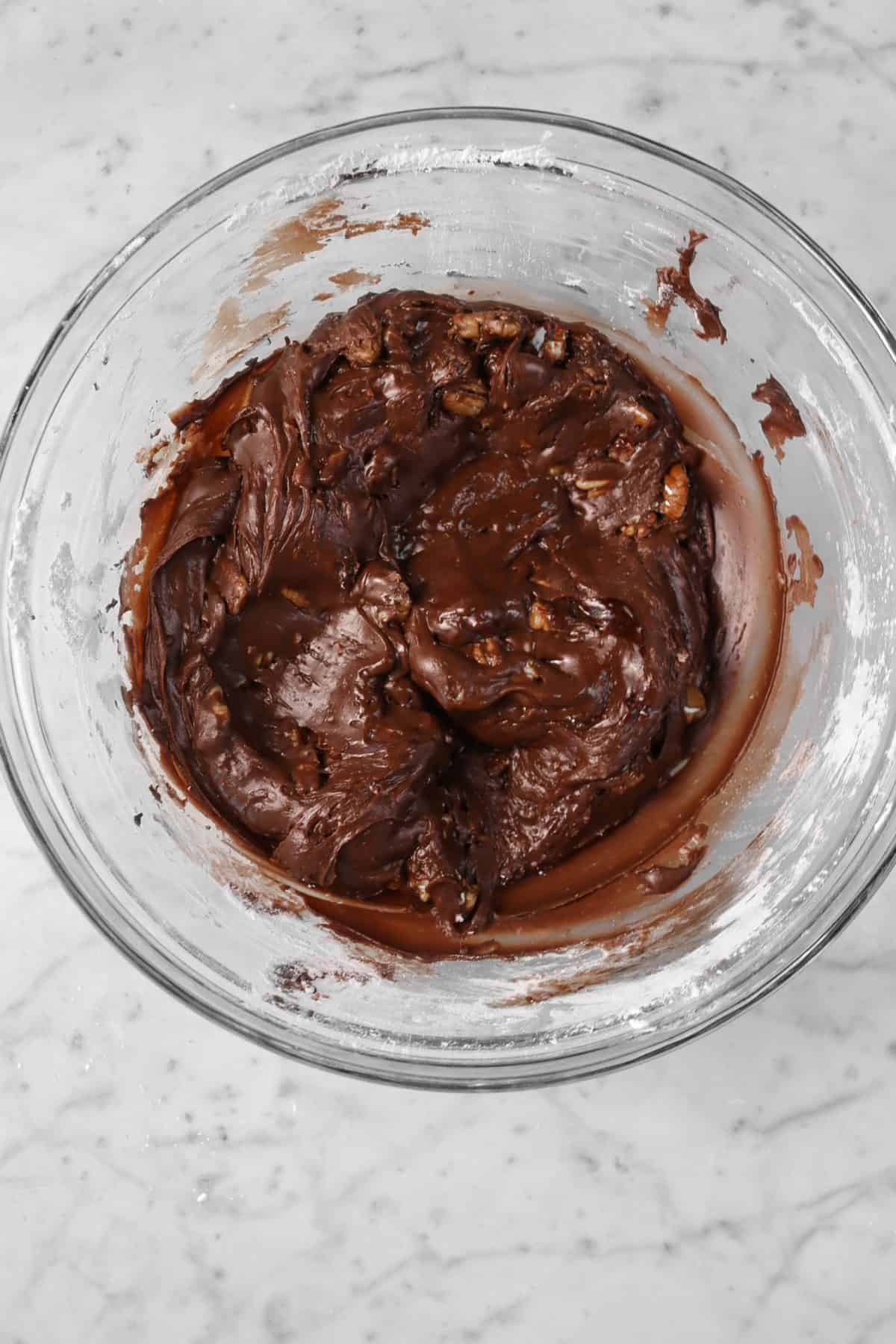 chocolate pecan frosting in a glass bowl