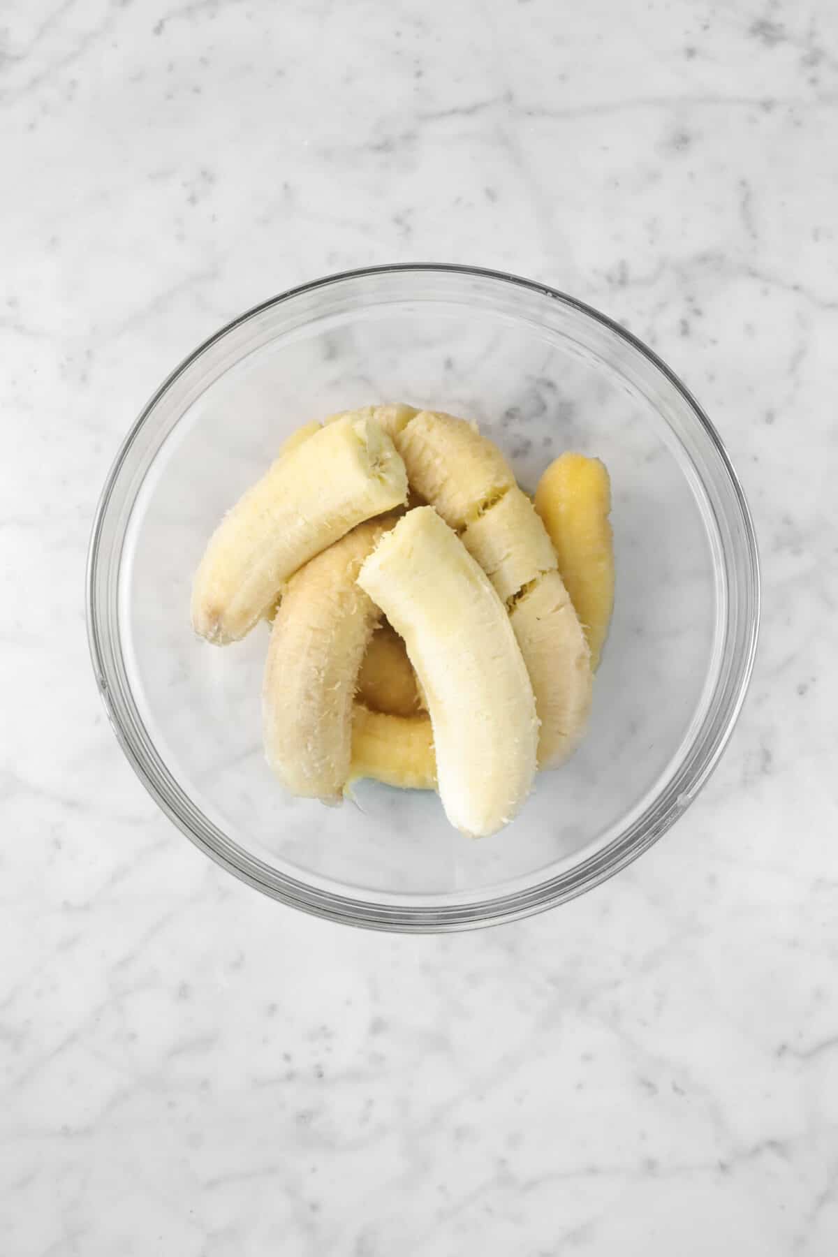 overripe bananas in a glass bowl