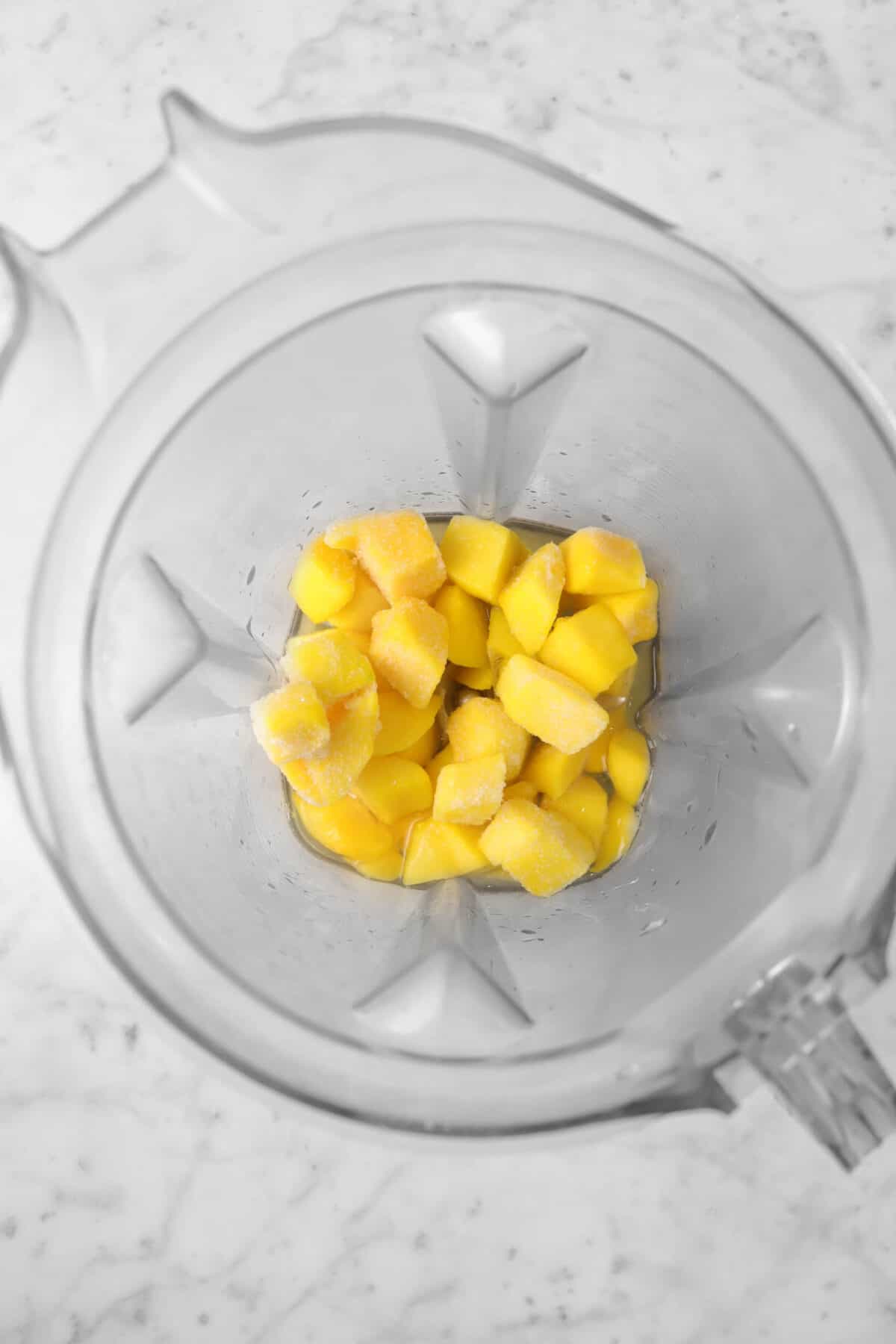 mango chunks, tequila, orange liqueur, and sour mix in a blender