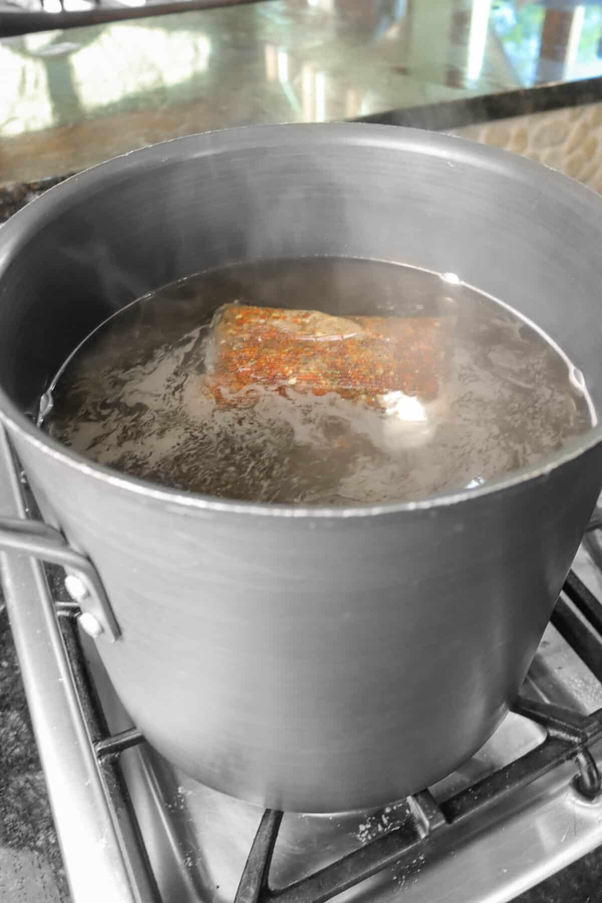 spice packet in a large pot of water