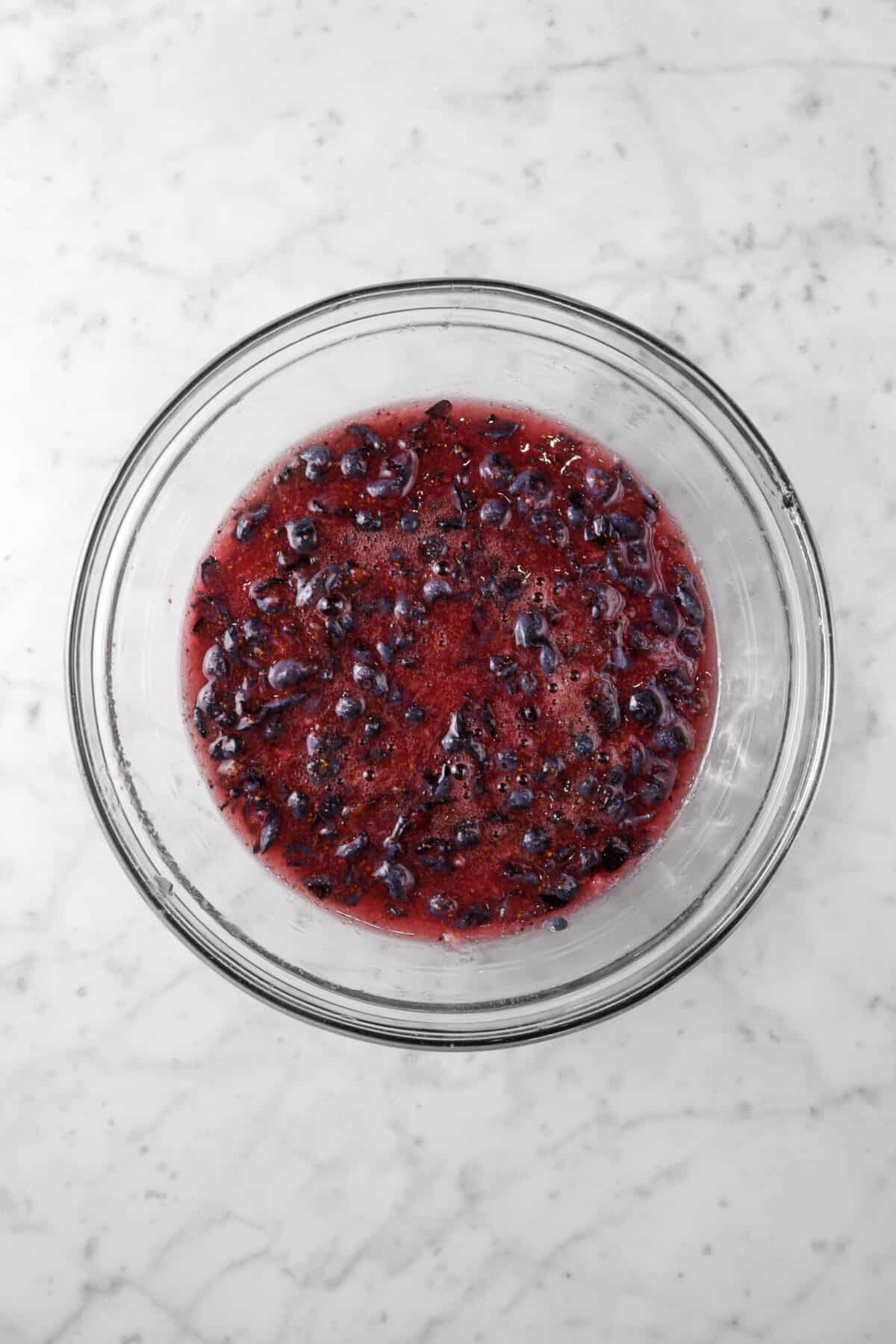 sugar mixed into crushed blueberries