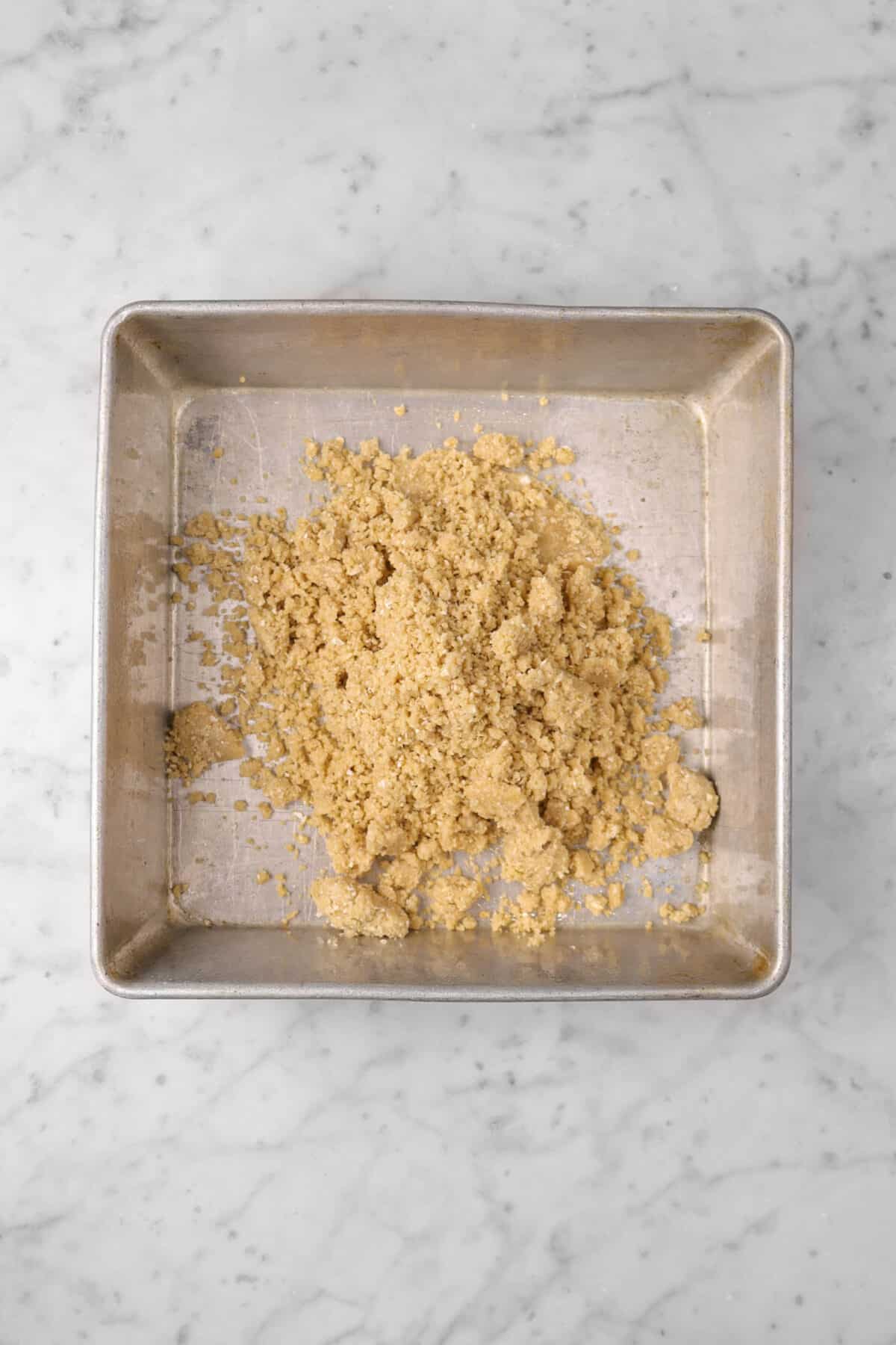 crumble mixture in a square pan
