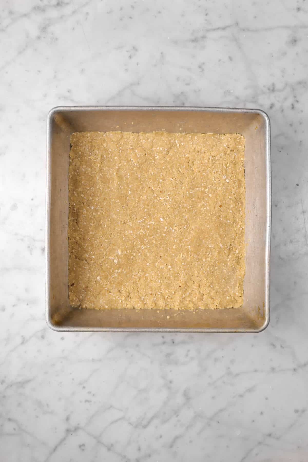 crumble mixture pressed down in square pan