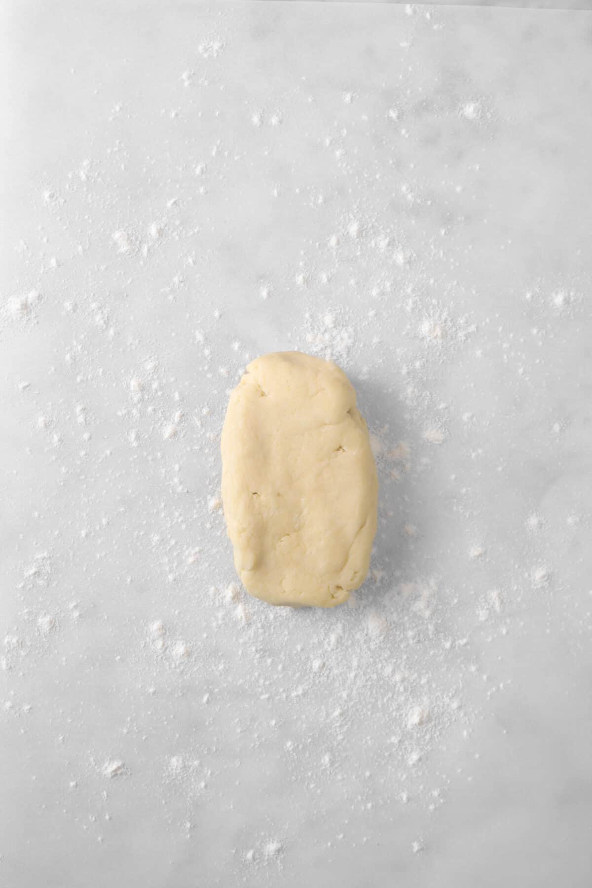 pastry dough on a piece of lightly floured parchment