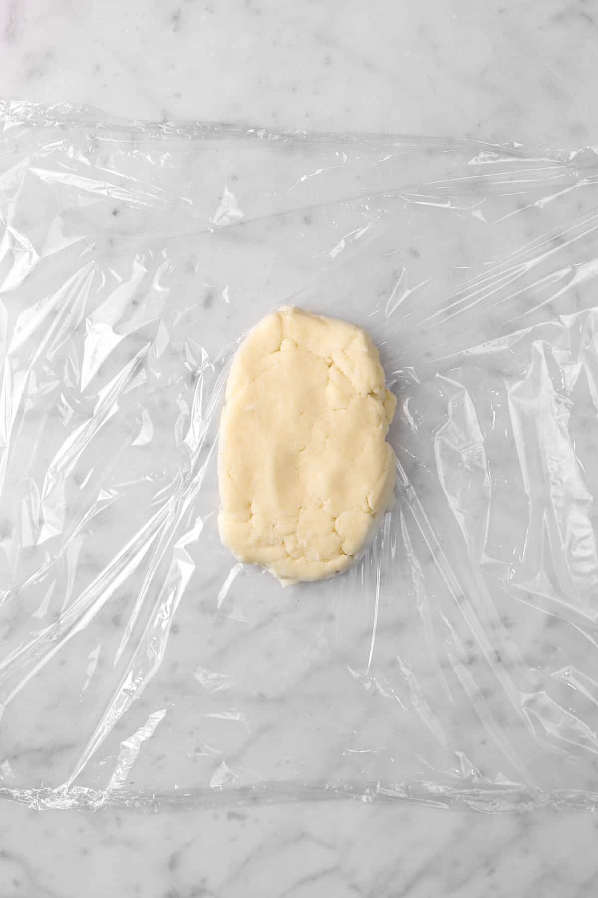pastry dough on a piece of plastic wrap