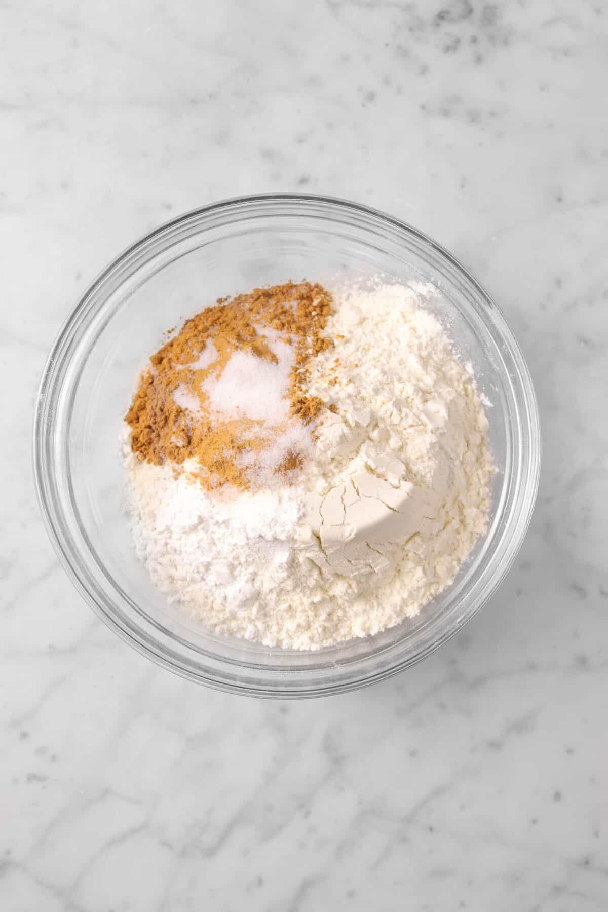 flour, sugar, cinnamon, baking powder, and salt in glass bowl