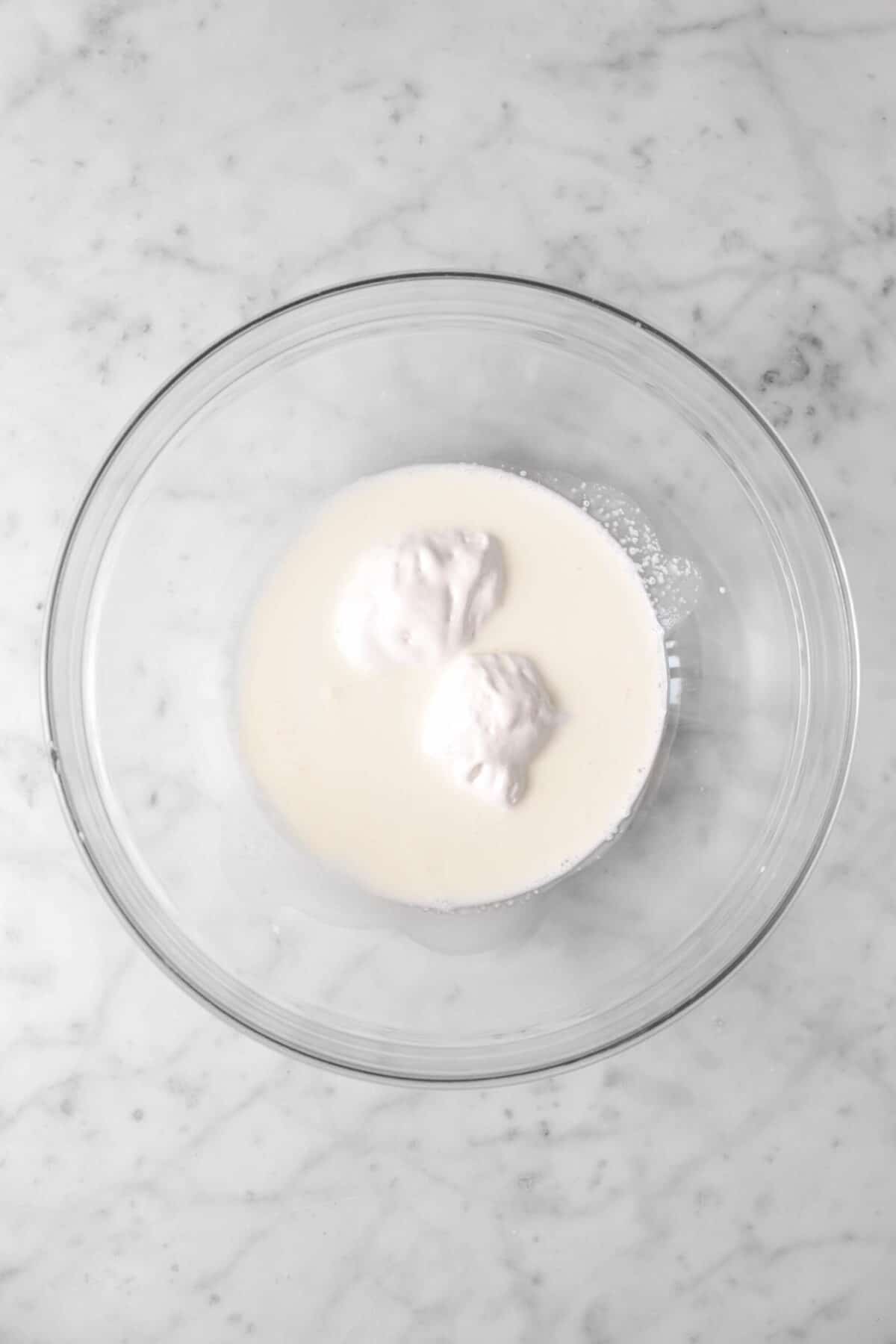 heavy cream and marshmallow fluff in a glass bowl