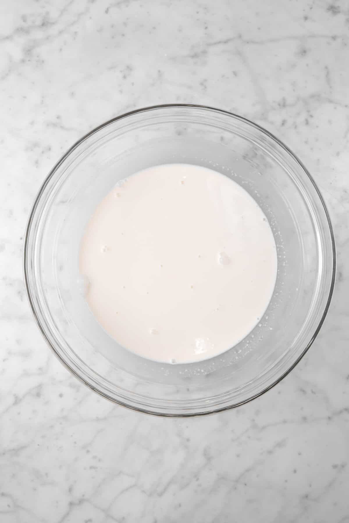 vanilla ice cream base in a glass bowl