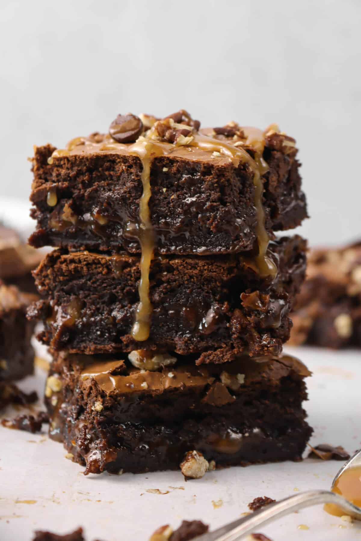 close shot of three stacked turtle brownies