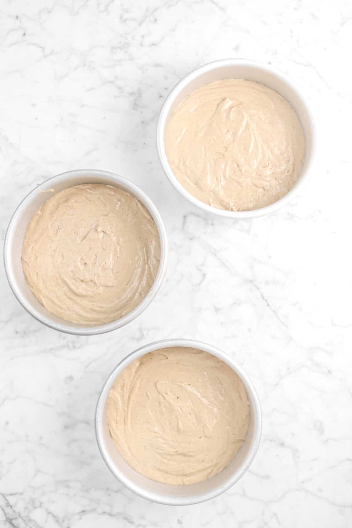 cake batter in three six inch circle pans