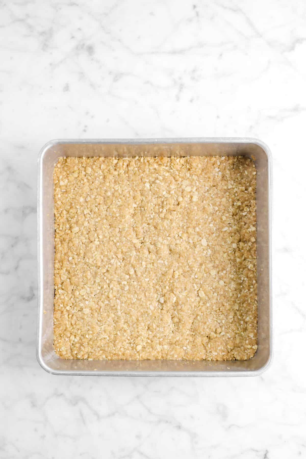 crumble bar base baked in a square pan