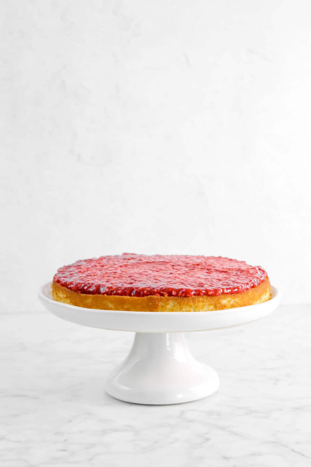 raspberry jam spread across cake layer