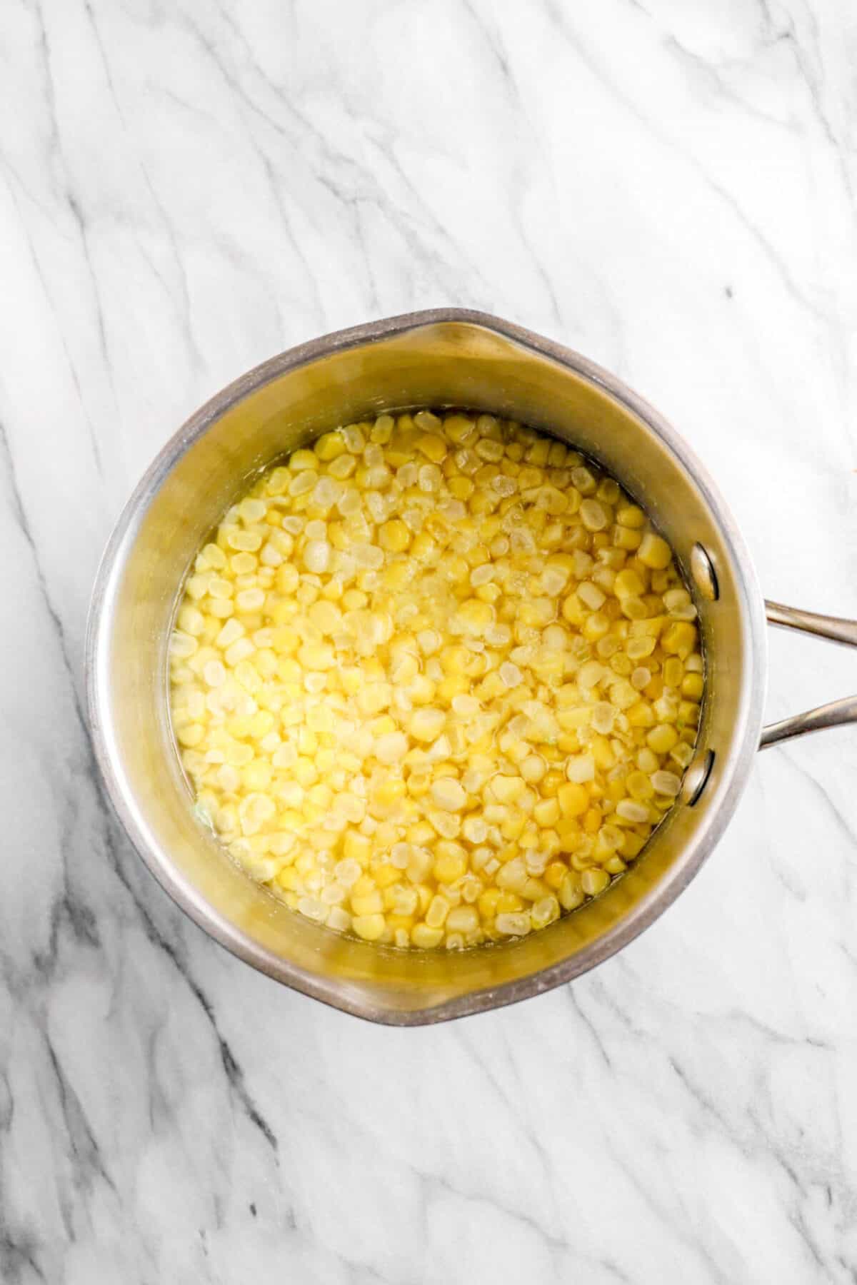 steamed corn in a small pot
