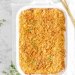 shoepeg corn and green bean casserole with two gold spoons and thyme
