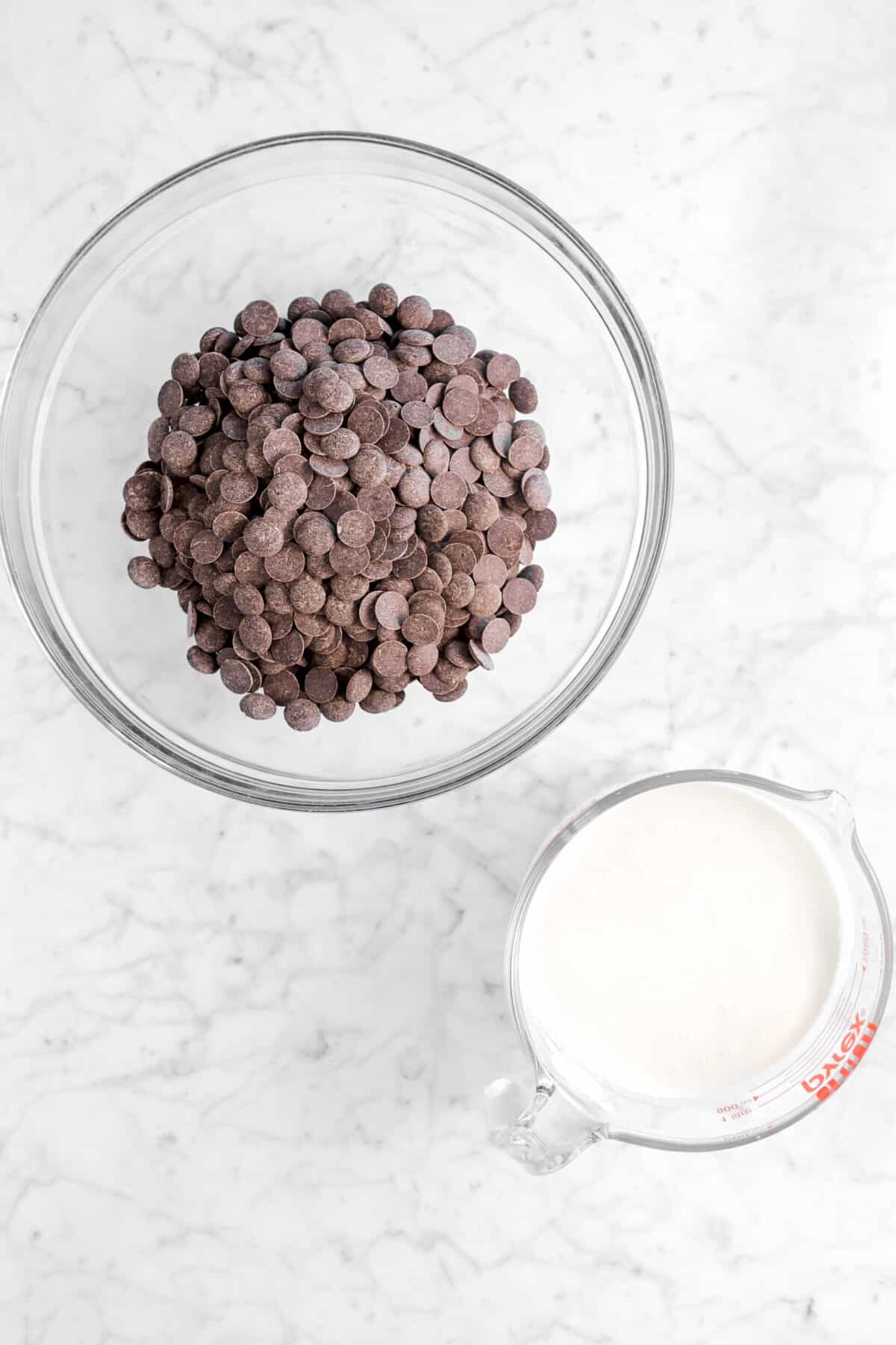 chocolate chips and milk on marble counter