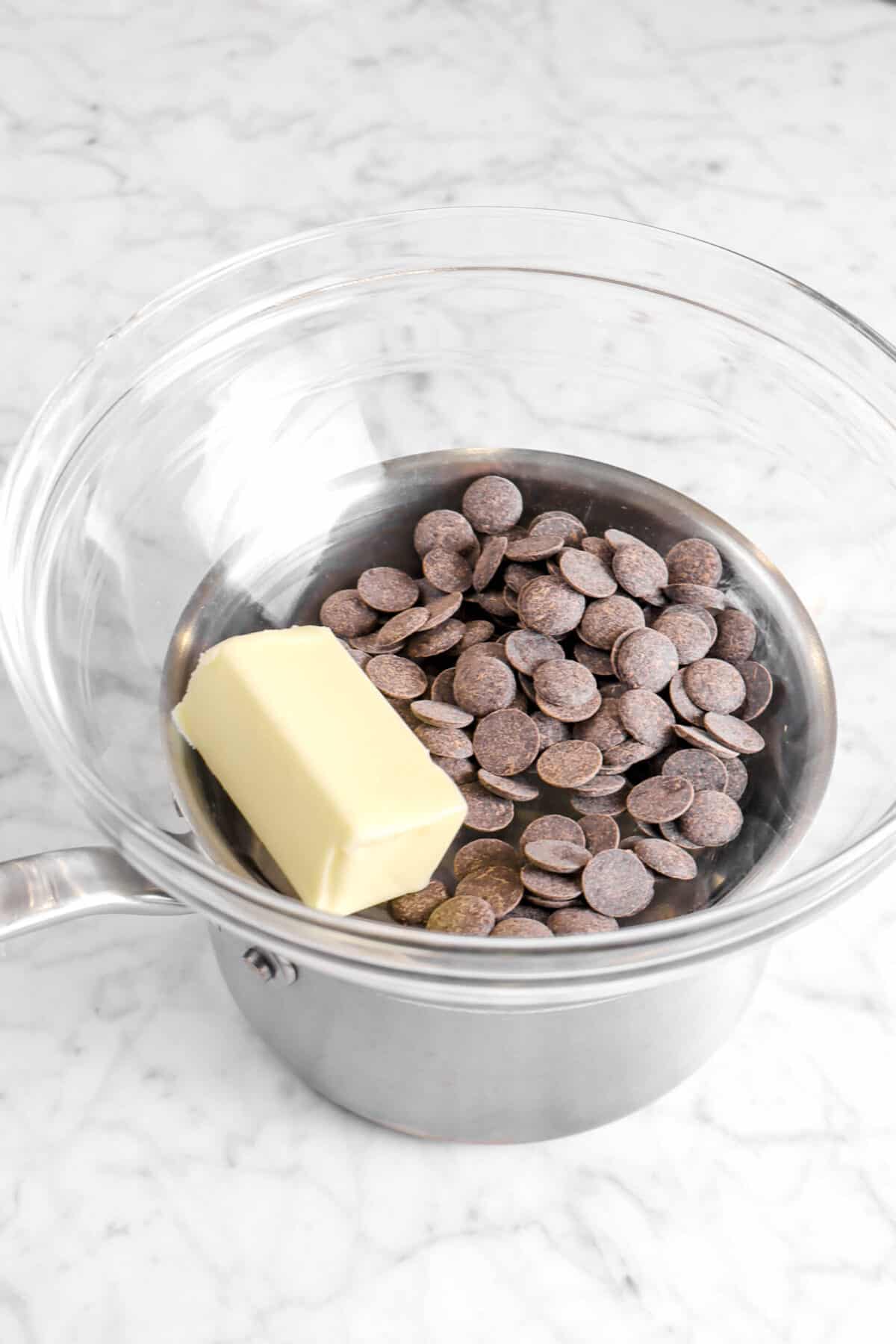 butter and chocolate in a glass bowl over a small pot
