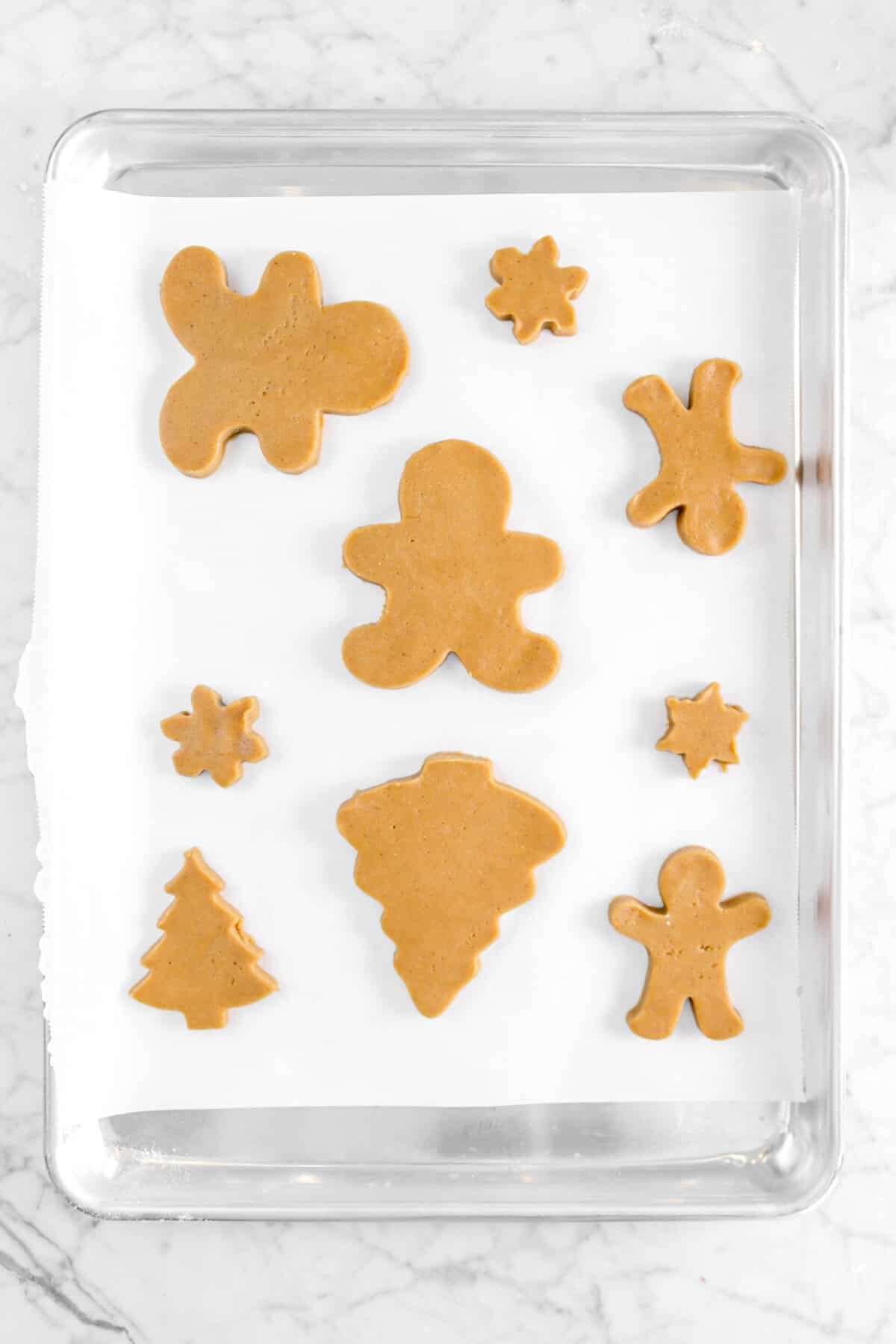 shaped cookies on baking sheet