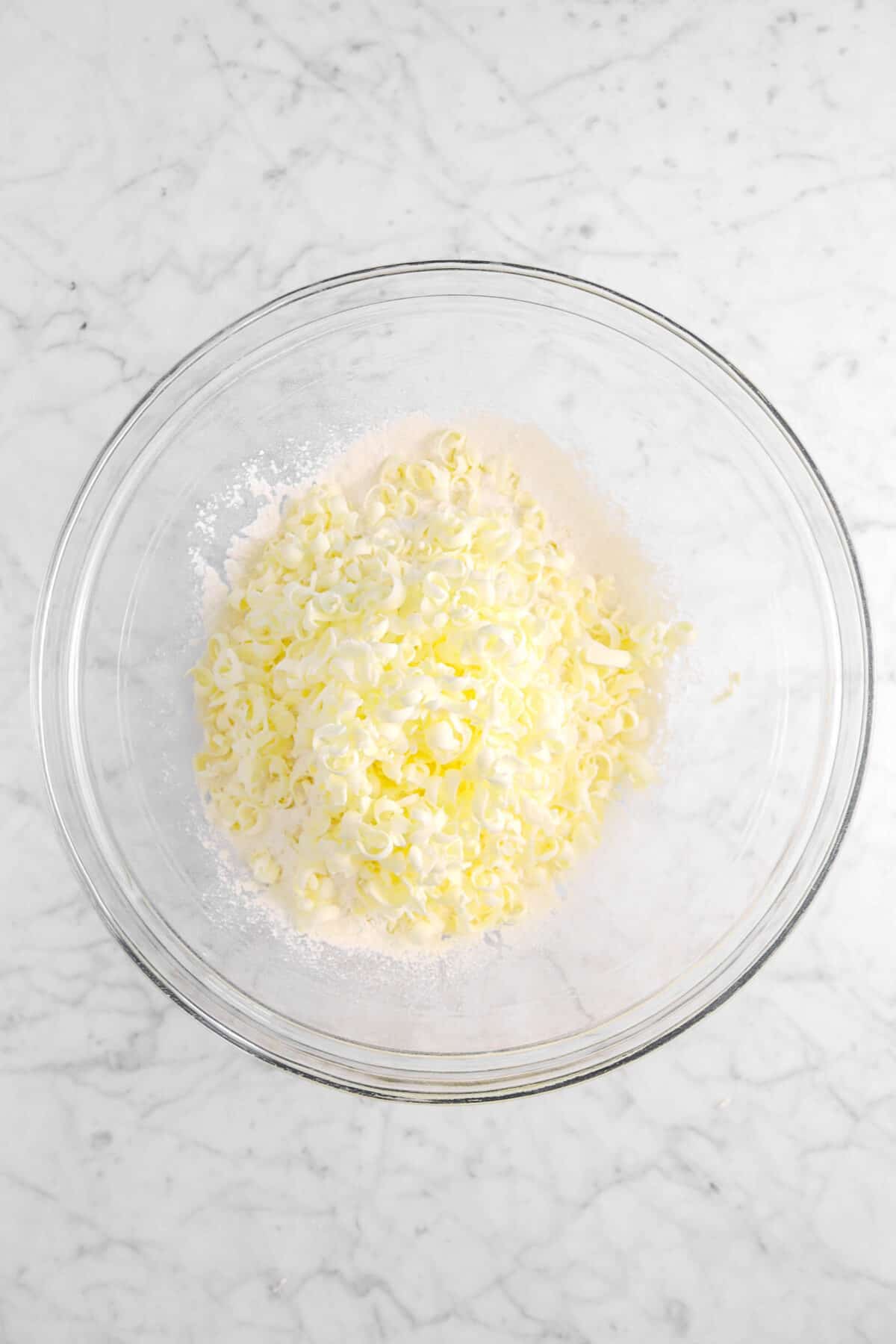 butter graded over dry ingredients