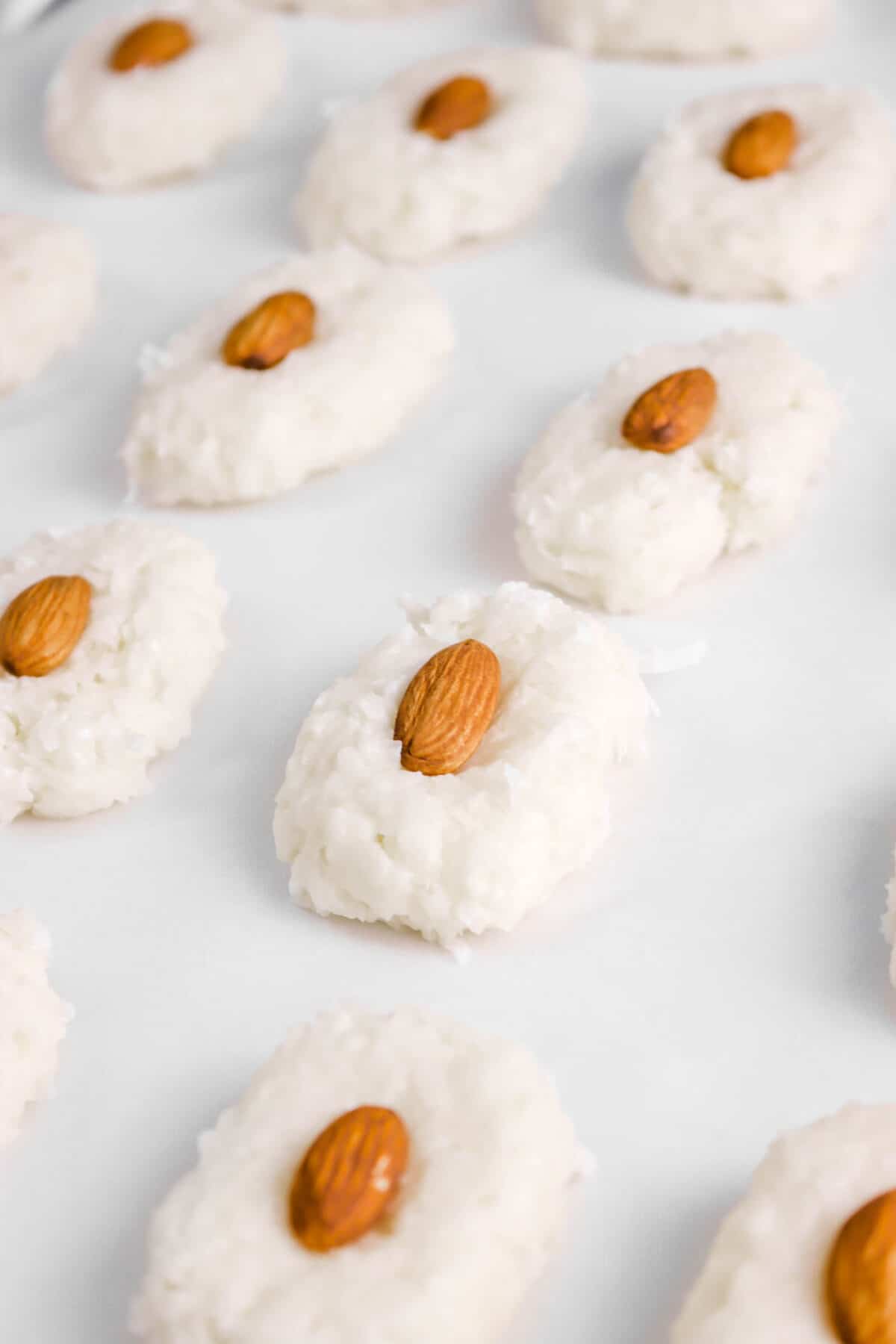 coconut filling formed into ovals with almond pressed on top