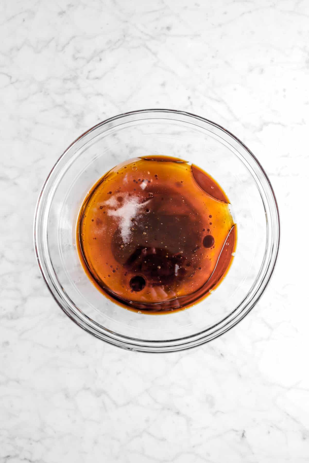 honey, vanilla, vegetable oil in glass bowl