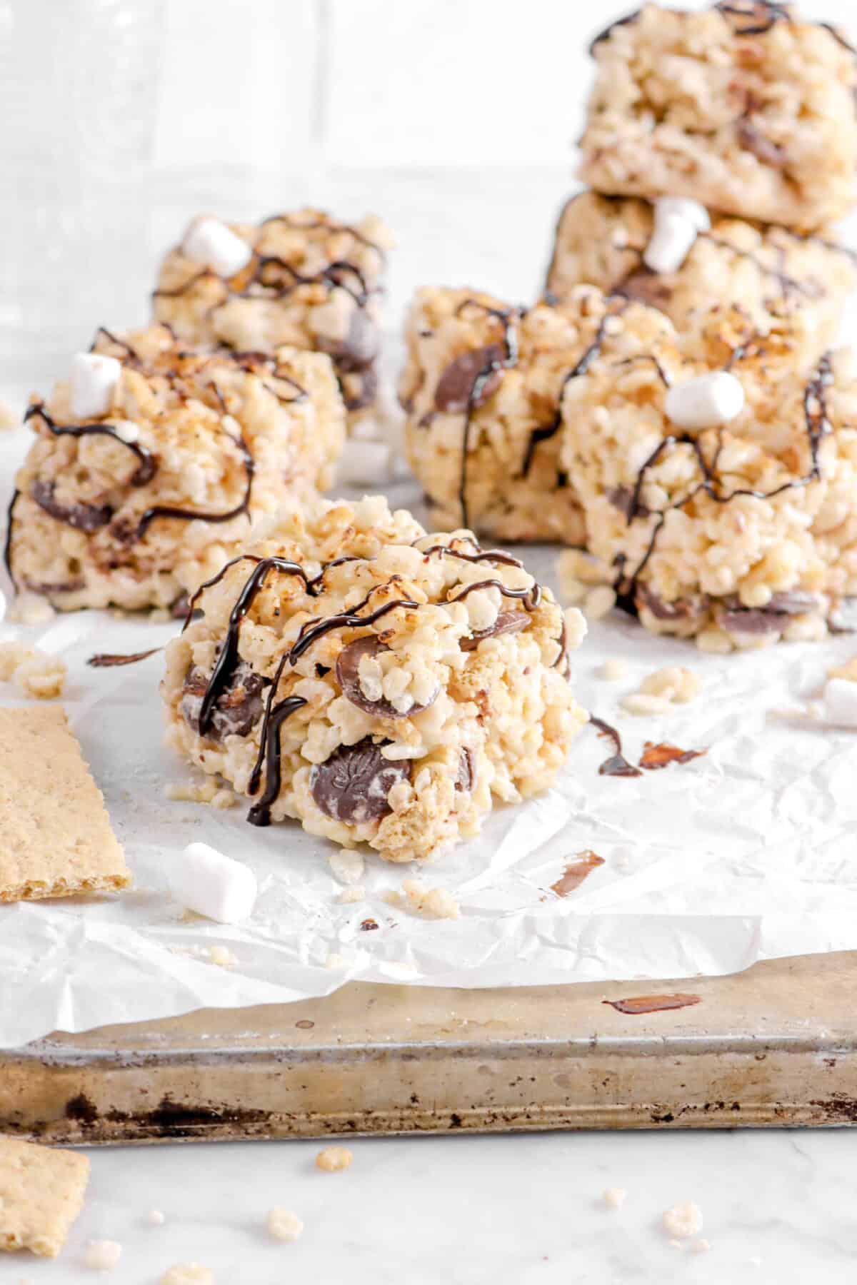 s'mores rice krispie treats on a sheet pan with graham crackers
