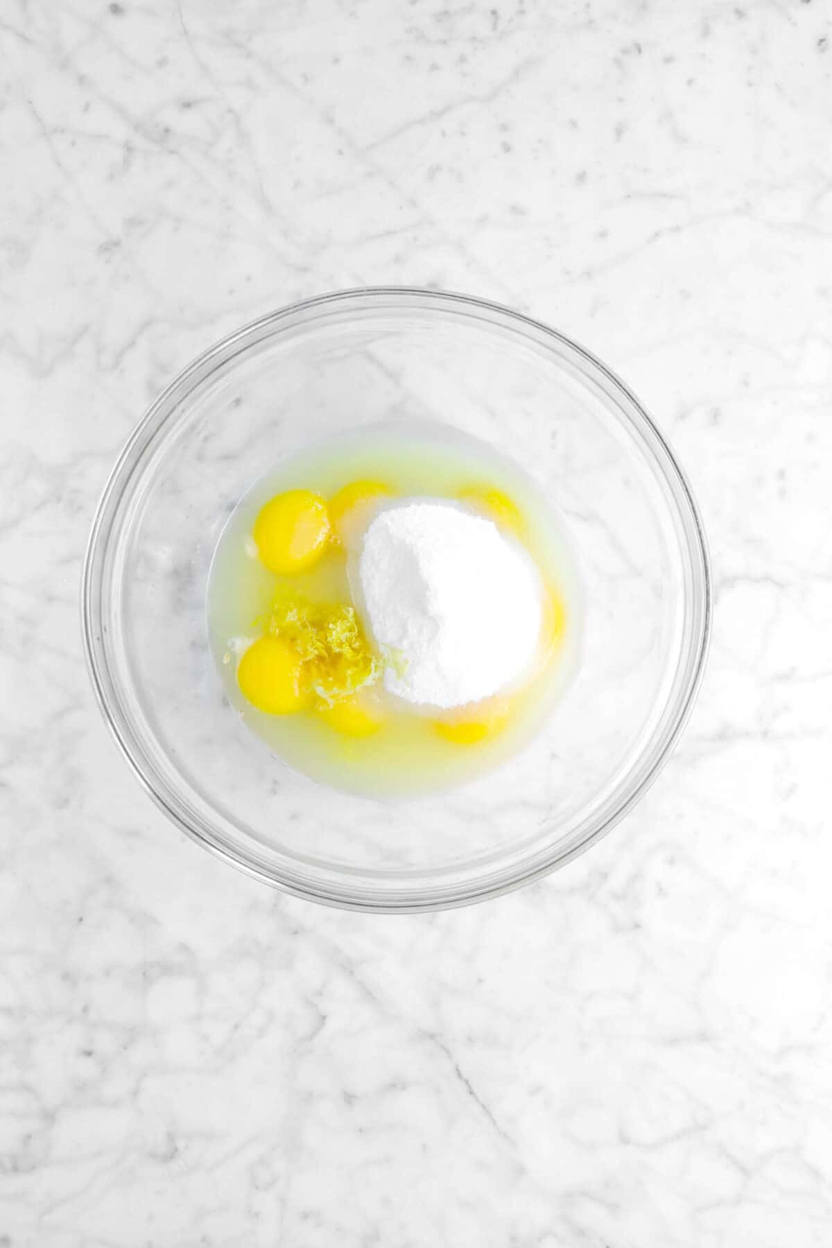 eggs, lemon juice, lemon zest, and sugar in glass bowl