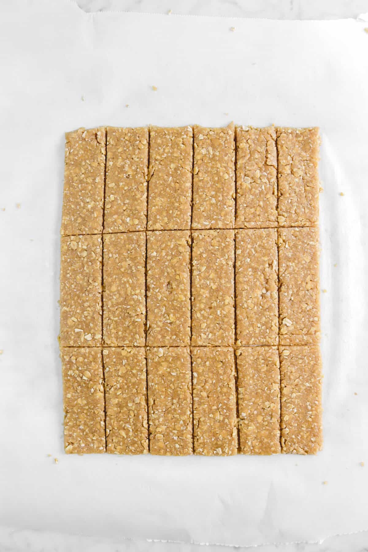 dough cut into eighteen rectangles on parchment paper
